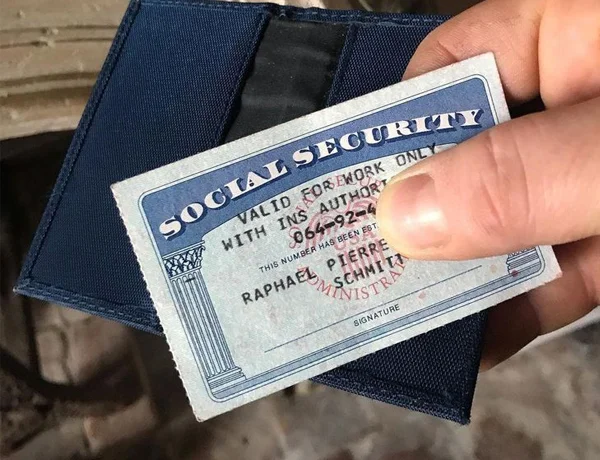 holding a social security card